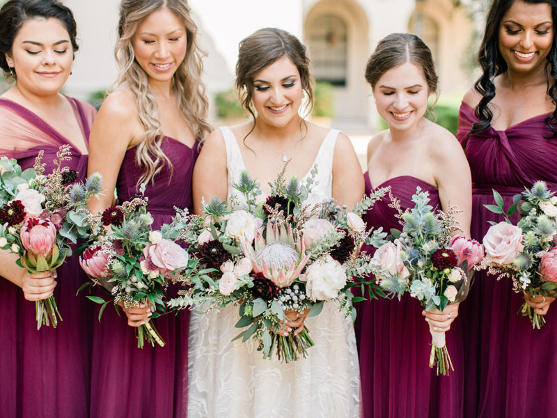 NOOR bride and her bridesmaids in burgundy with beautiful matching bouquets