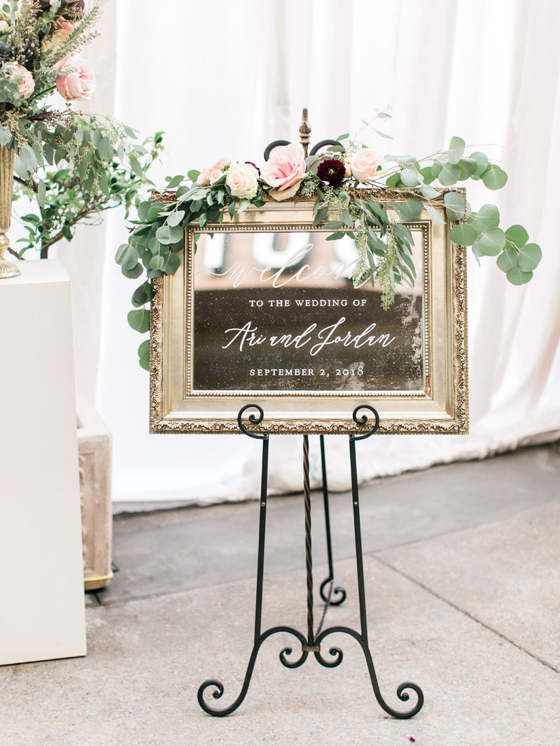 wedding welcome sign in calligraphy on an antique mirror