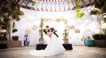 bride and groom dip kiss on the terrace at noor los angeles