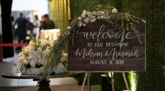 wedding decor welcome sign with floral arrangement