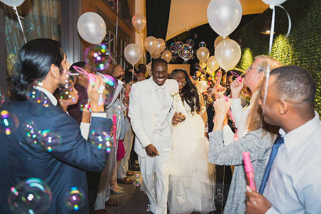 bride and groom balloons and bubbles exit at NOOR pasadena banquet halls in pasadena