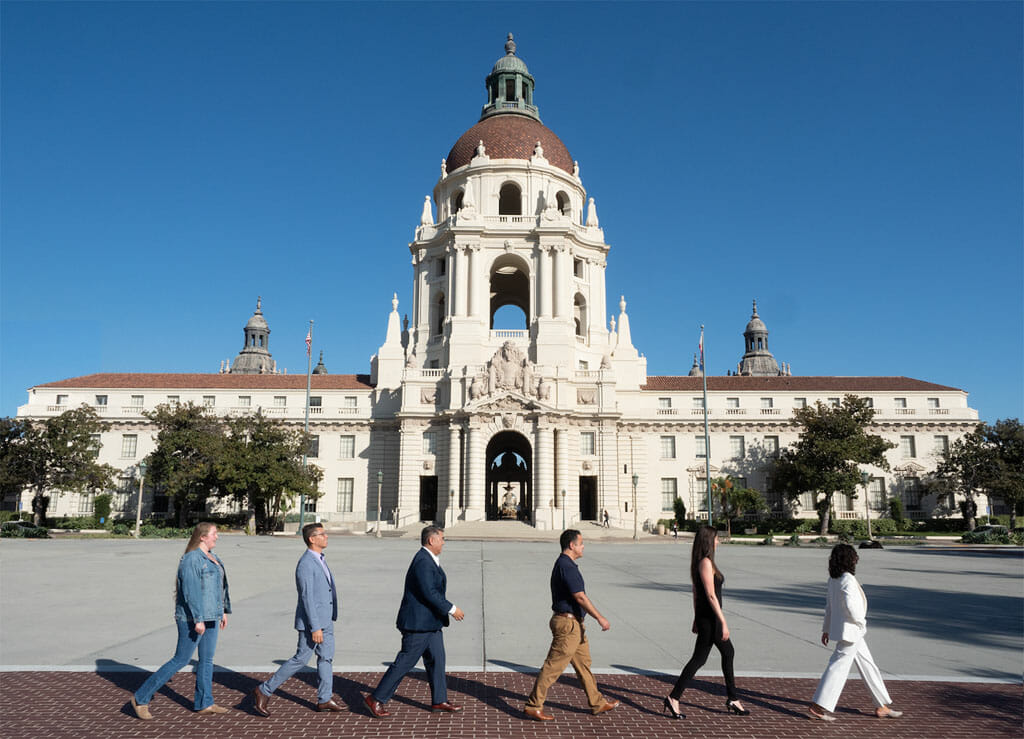 noor los angeles event management team walking in front of pasadena city hall