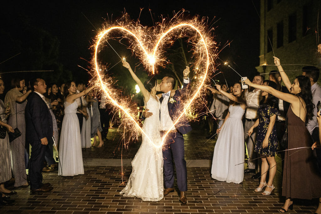 wedding sparkler couple drawing heart in the air
