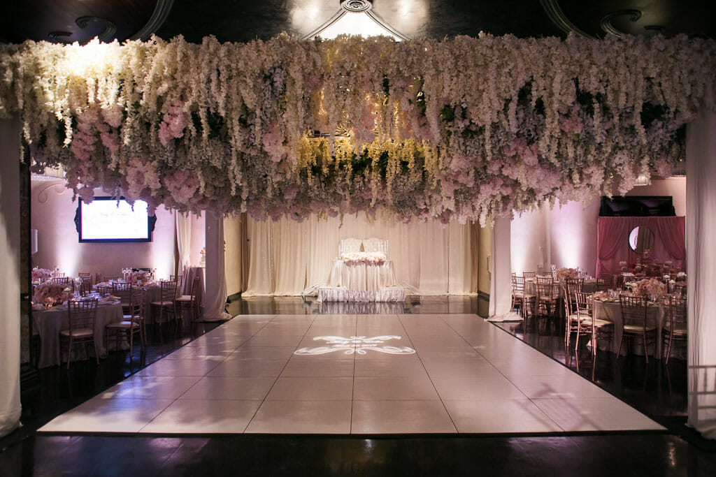 los angeles banquet hall at noor with hanging floral ceiling by shawna yamamoto
