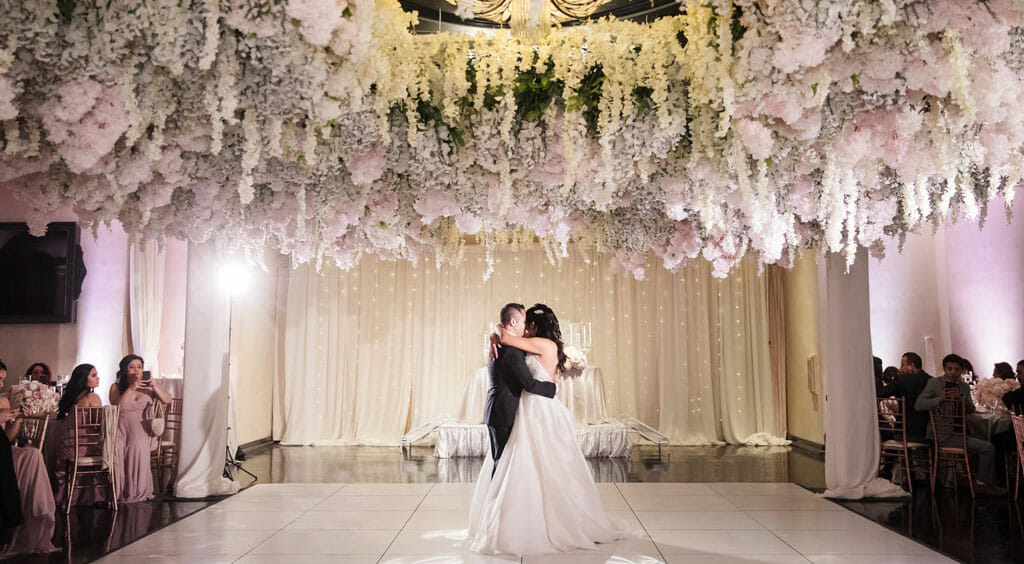 romantic first dance under a floral canopy at noor's sofia banquet hall