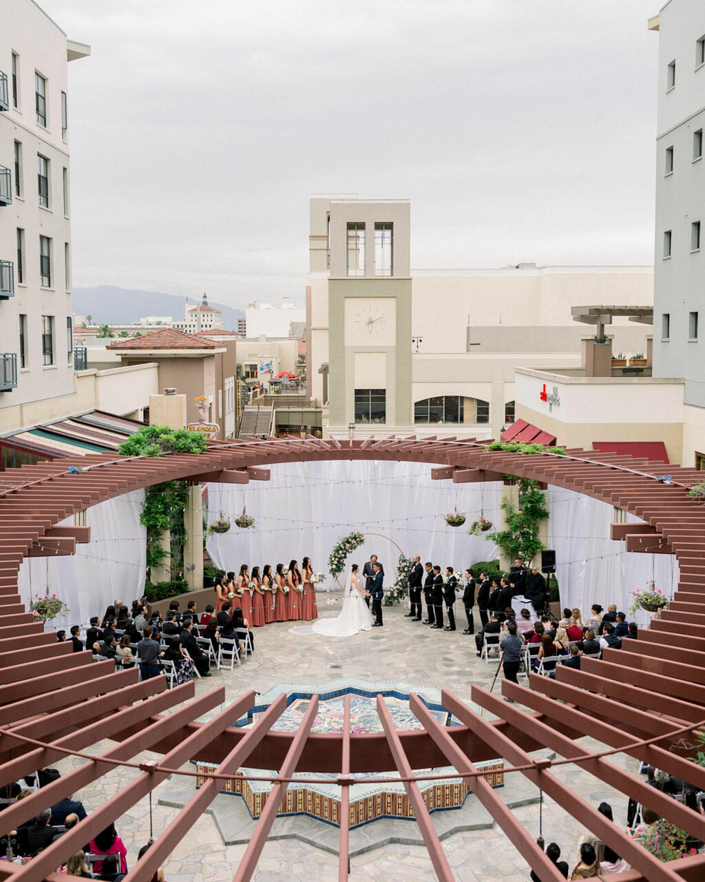 birds eye view of an outdoor wedding ceremony taking place on the NOOR terrace