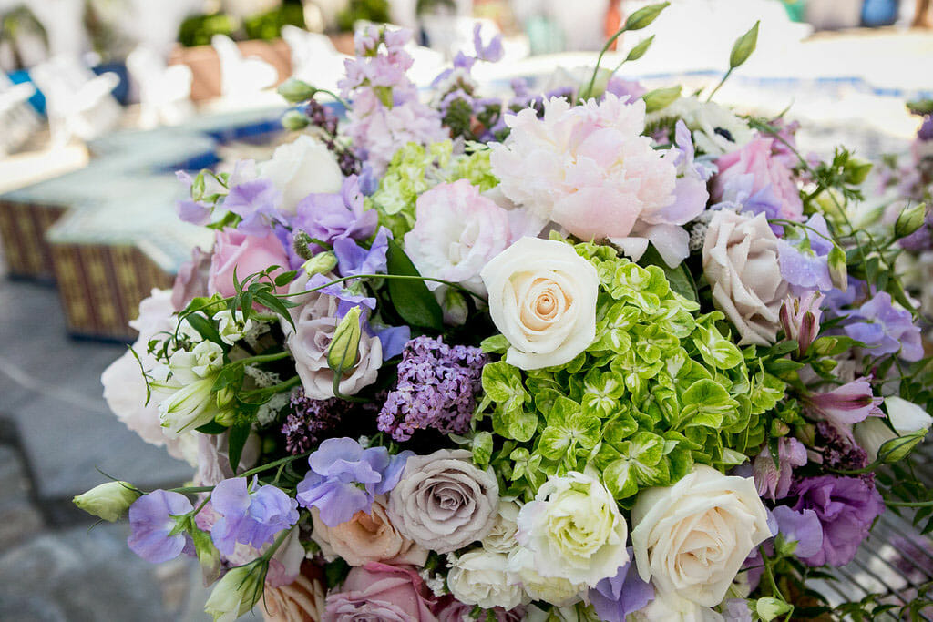 flower arrangement with purple, pink and white at outdoor wedding ceremony on the NOOR terrace