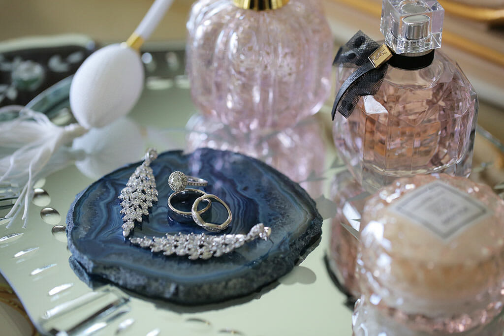 perfume bottles and jewelry wedding day bridal details