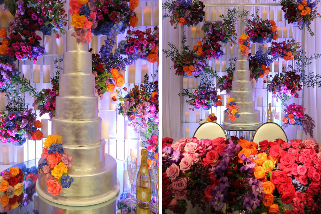tall wedding cake adorned with flowers