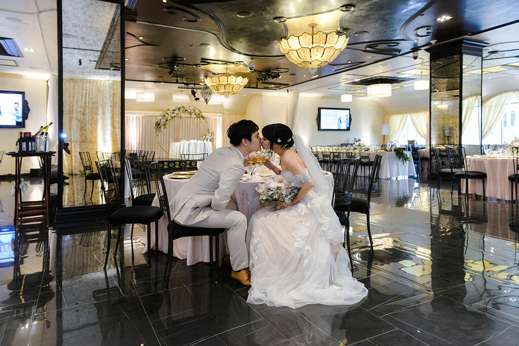bride and groom kissing in NOOR los angeles banquet hall sofia ballroom