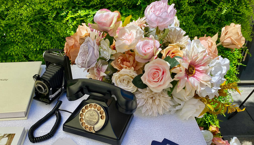 old fashioned telephone and floral arrangement at the noor in paris wedding show