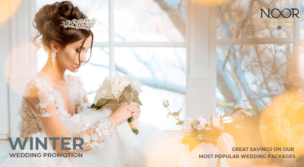 bride poses with bouquet in a wintry setting to highlight winter wedding promotions at noor