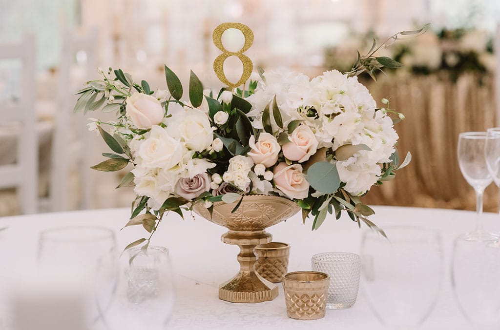 wedding centerpiece and table number in blush pink with gold accents