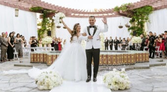 smiling bride and groom at luxury wedding ceremony on the noor terrace in pasadena