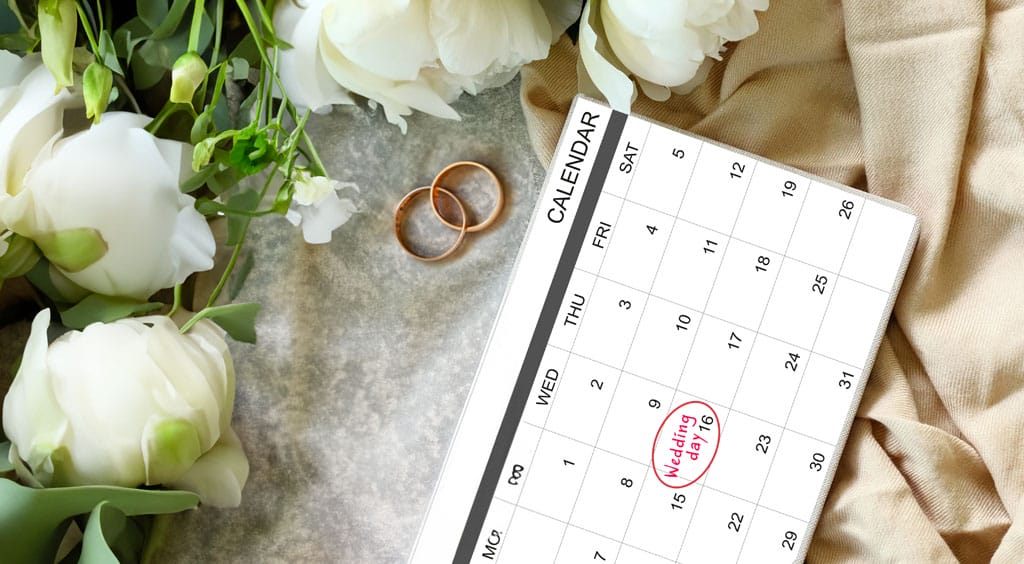 wedding calendar with flowers and weddings rings