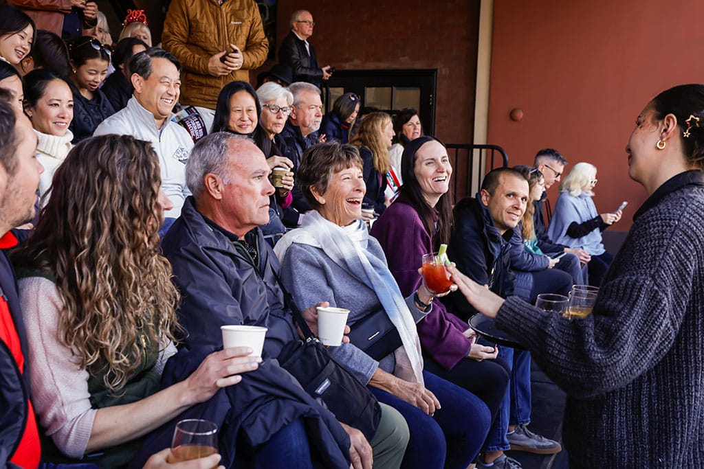 Guests at NOOR's rose parade champagne brunch on the sofia balcony