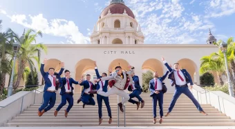 groom and groomsmen jumping for joy outside pasadena city hall