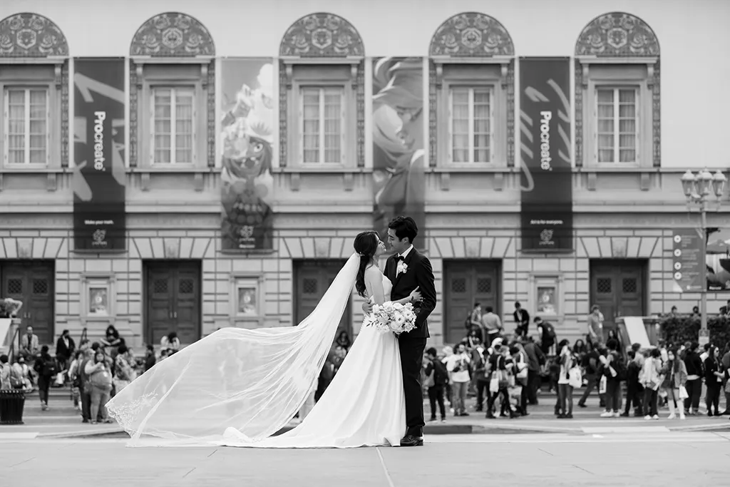 noor wedding couple embrace on the noor promenade at the paseo