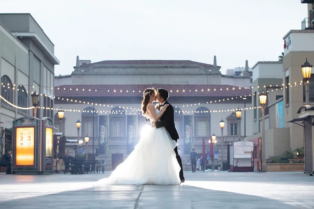 wedding couple embrace at the noor promenade at the paseo